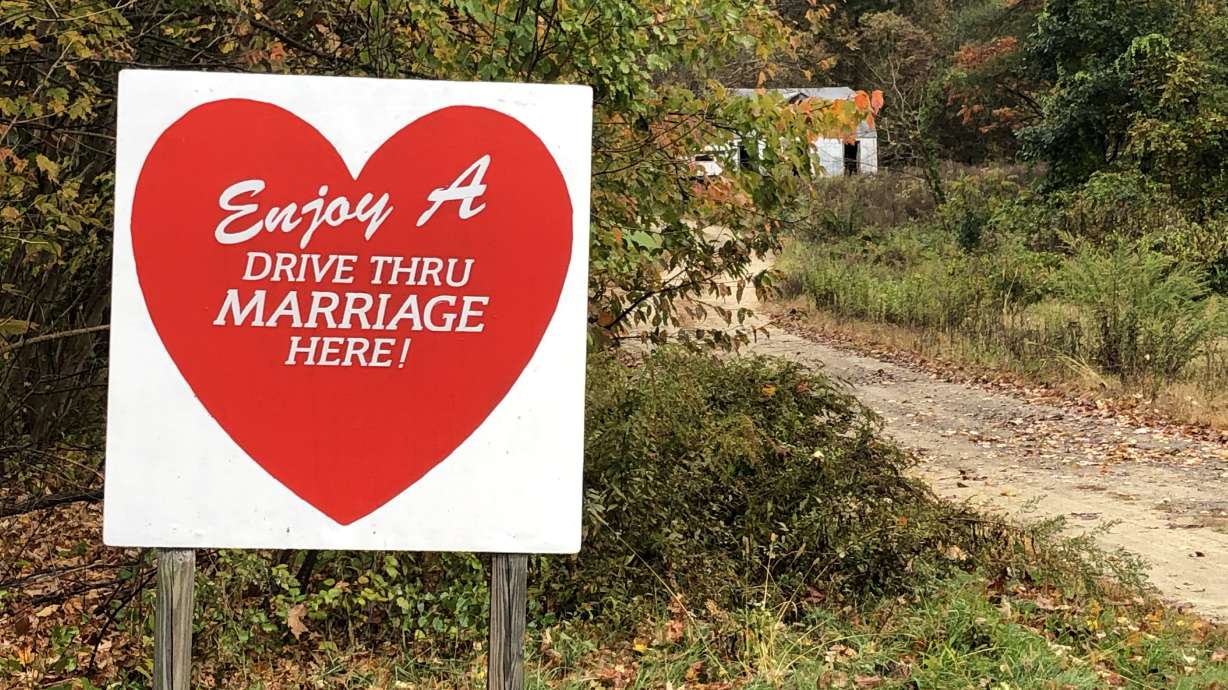 A sign in western Massachusetts advertises drive-through weddings at a home of a justice of the peace.