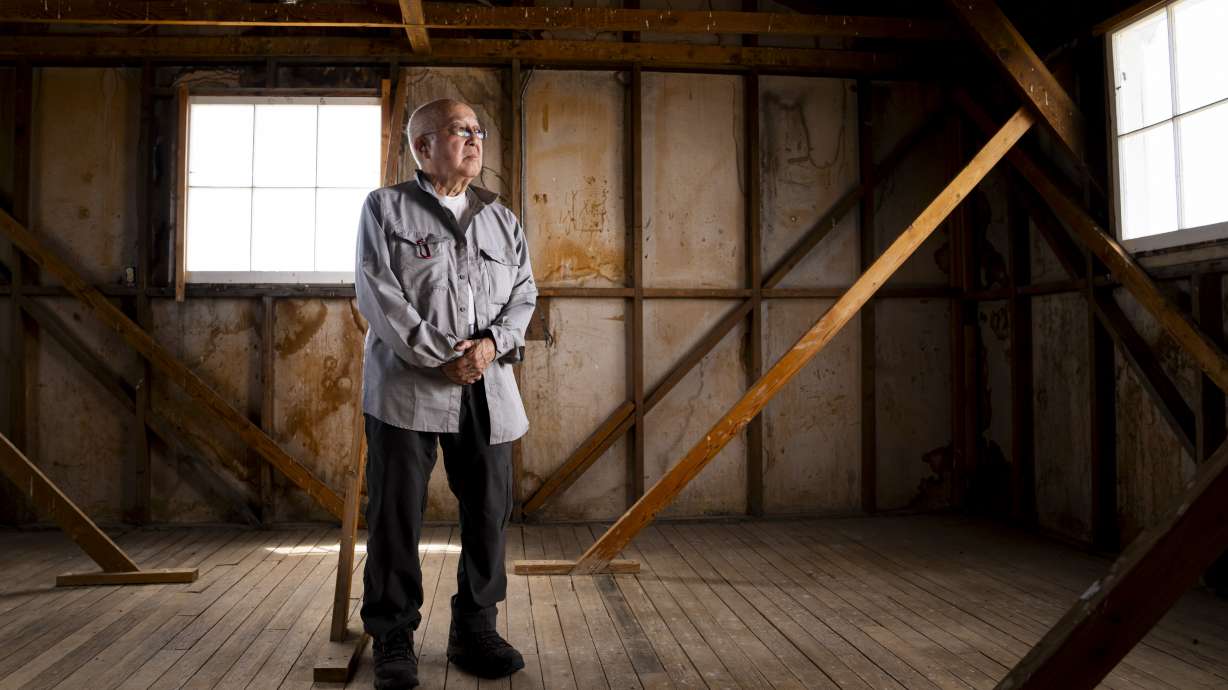 Paul Tomita poses for a portrait in a historic barracks at Minidoka National Historic Site, July 8, in Jerome, Idaho. Tomita says the constant desert dust that seeped even into the barracks repeatedly sent him to the camp hospital.