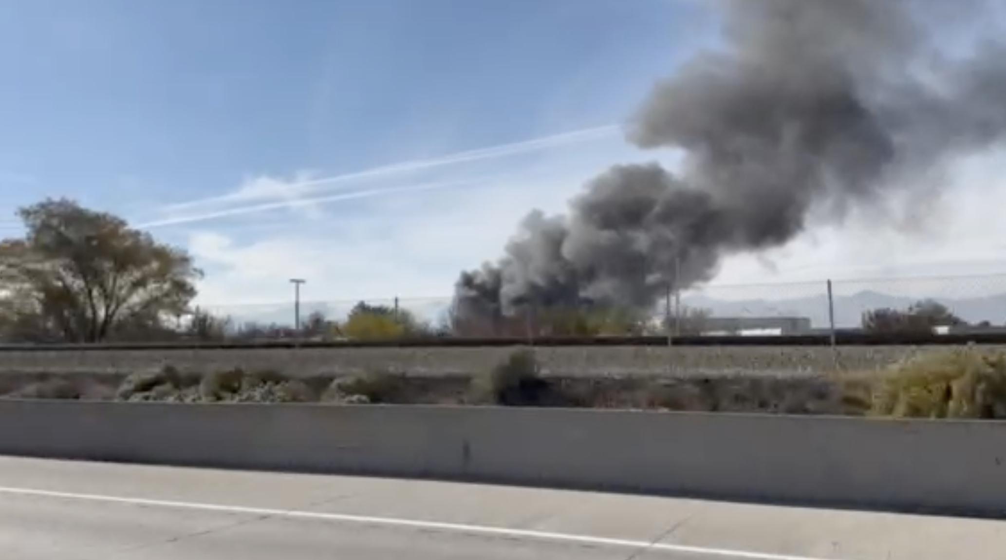 Smoke from a chemical fire in Sandy is seen in a screenshot from a video taken from I-15 on Friday.