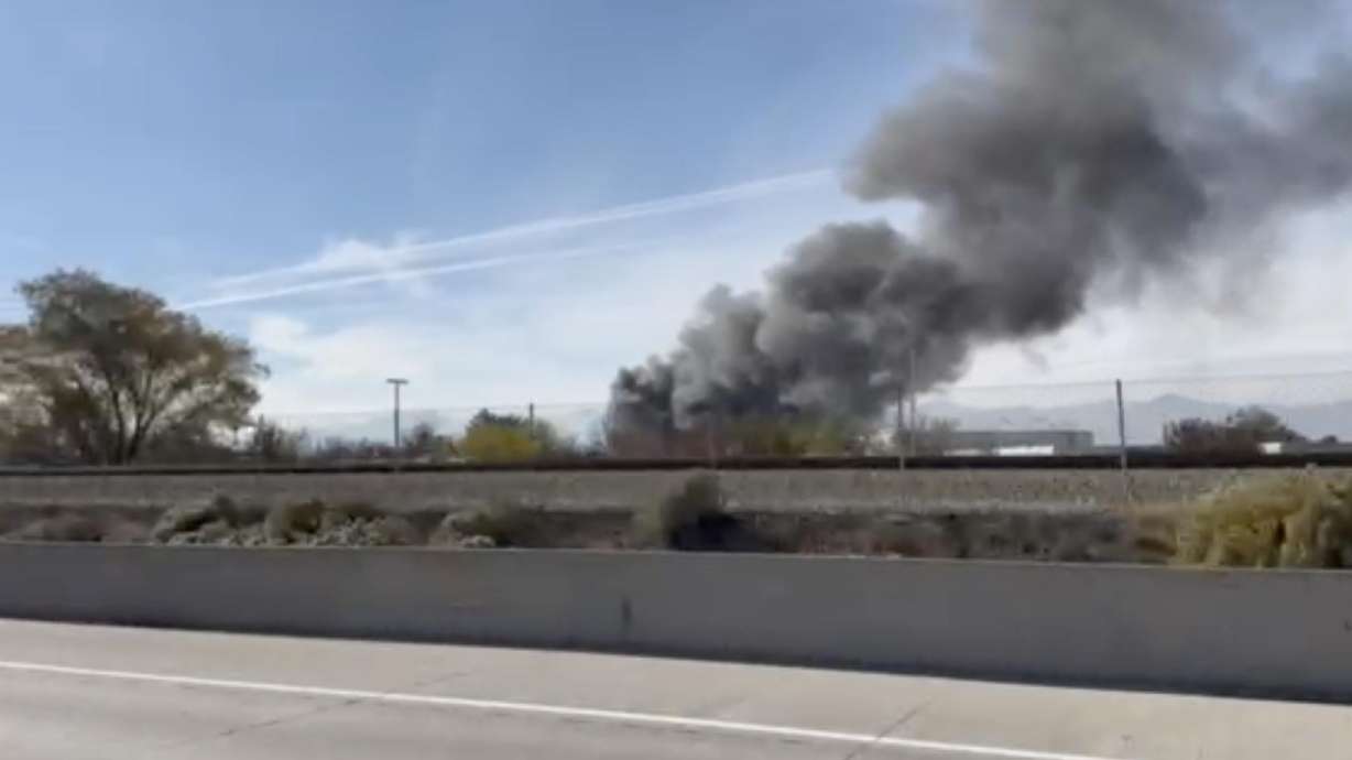 Smoke from a chemical fire in Sandy is seen in a screenshot from a video taken from I-15 on Friday.