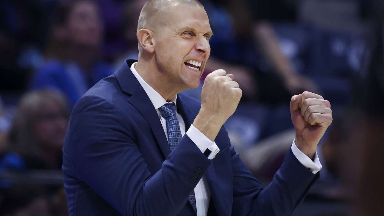 BYU basketball coach Mark Pope celebrates with fans after BYU’s win against San Diego State at BYU’s Marriott Center in Provo on Friday, Nov. 10, 2023.