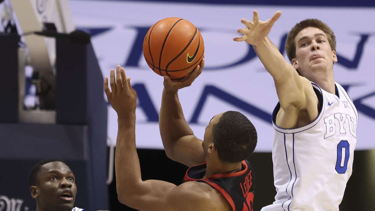 Brigham Young forward Atiki Ally Atiki (4) and Noah Waterman (0) double-team San Diego State Aztecs forward Jaedon LeDee (13) at BYU’s Marriott Center in Provo on Friday, Nov. 10, 2023.