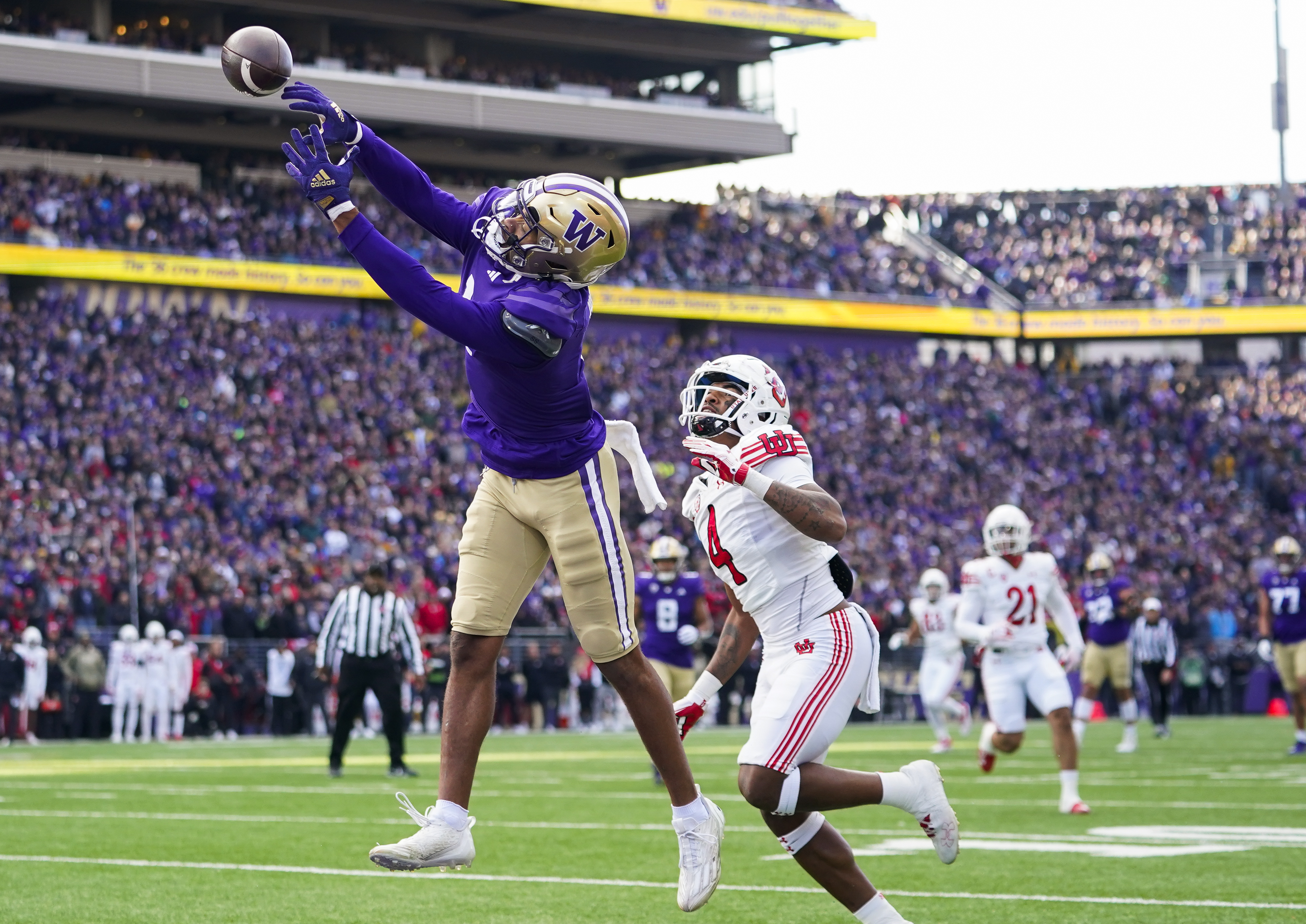 Washington wide receiver Rome Odunze, left, can't bring in a pass in the end zone against Utah cornerback JaTravis Broughton (4) during the first half of an NCAA college football game Saturday, Nov. 11, 2023, in Seattle.