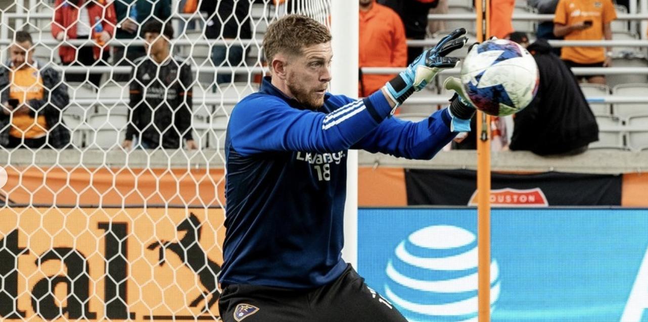Zac MacMath stops a shot during warm-ups in Houston. 