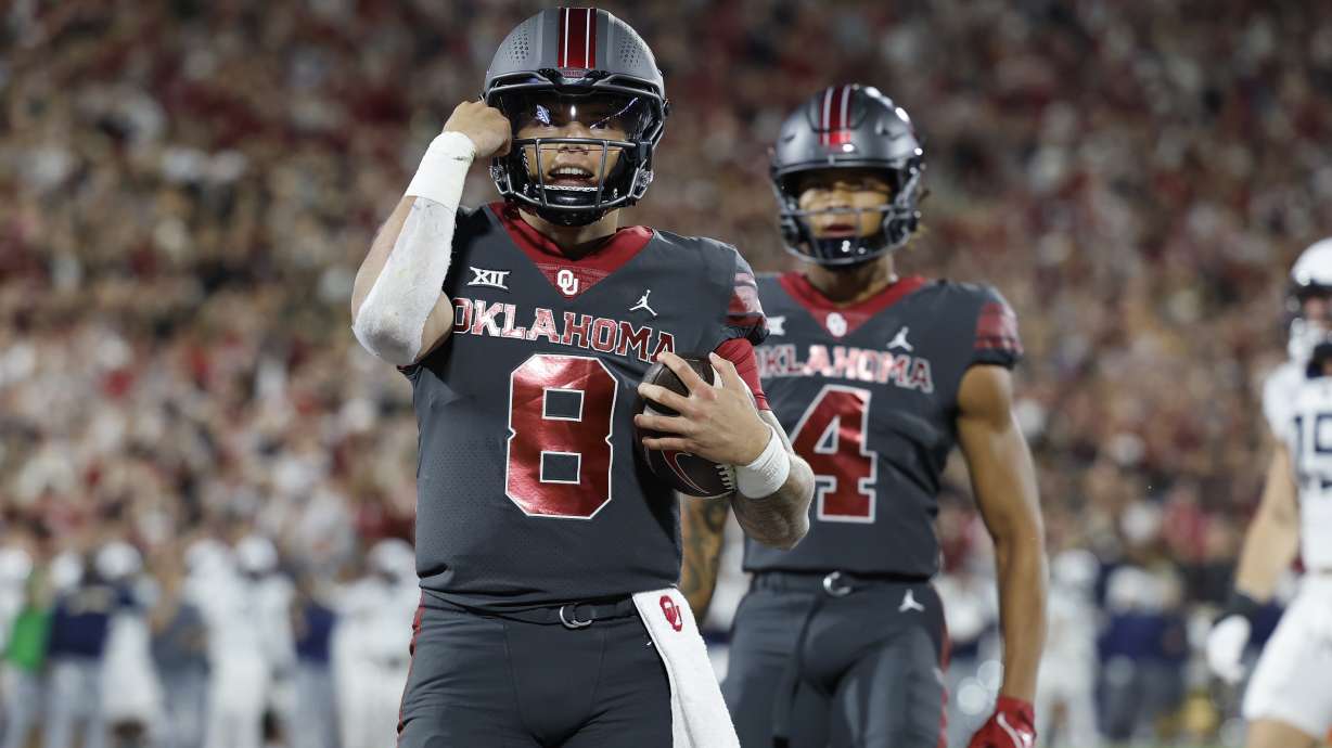 Oklahoma quarterback Dillon Gabriel (8) celebrates after a touchdown against West Virginia during the first half of an NCAA college football game Saturday, Nov. 11, 2023, in Norman, Okla.
