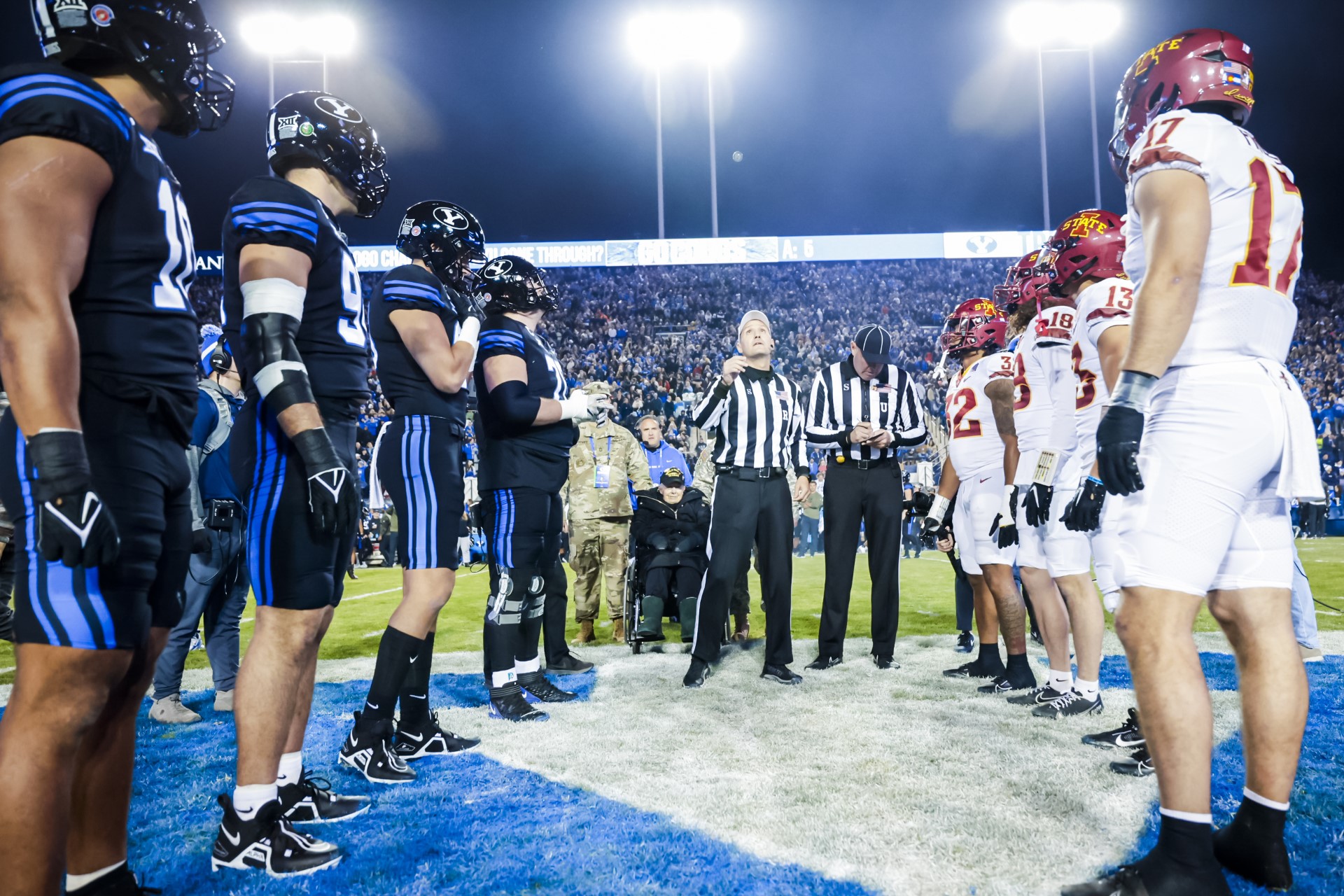 A 102-year-old World War II veteran, who happens to be one of BYU's biggest fans, was given the opportunity to flip the game coin during Saturday's Veterans Day home game.