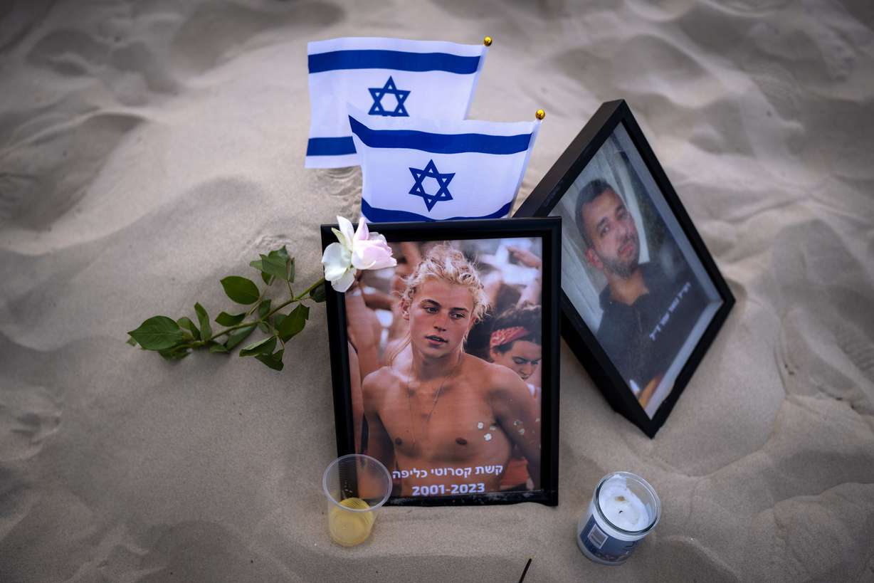 A photo of Keshet Casarotti, 21, who was killed in Hamas' militants rampage through Nova Music Festival in southern Israel on Oct. 7, is displayed at a vigil on the beach honoring the victims in Tel Aviv, Israel, Saturday. At least 260 Israelis were killed by Hamas militants at the outdoor music festival, among the total 1,200 people killed and 240 people abducted from Israel during Hamas' unprecedented cross-border assault.