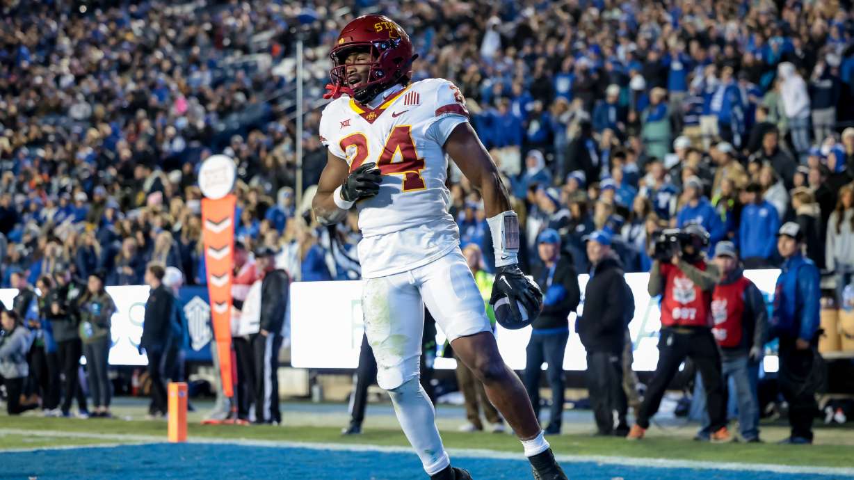 Iowa State running back Abu Sama III (24) celebrates after running the ball for a touchdown, putting the Cyclones up 31-7 after the PAT, during the game against the BYU Cougars at LaVell Edwards Stadium in Provo on Saturday, Nov. 11, 2023.