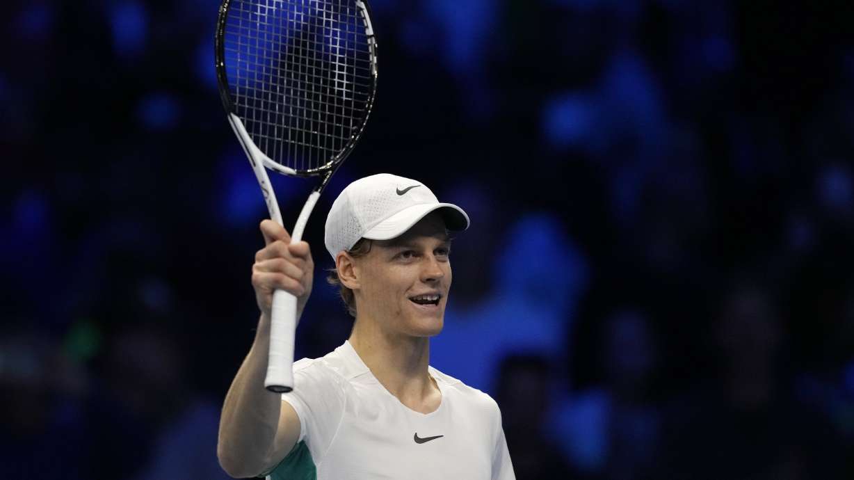Italy's Jannik Sinner celebrates after winning against Greece's Stefanos Tsitsipas during the singles tennis match , of the ATP World Tour Finals at the Pala Alpitour, in Turin, Italy, Sunday, Nov. 12, 2023.