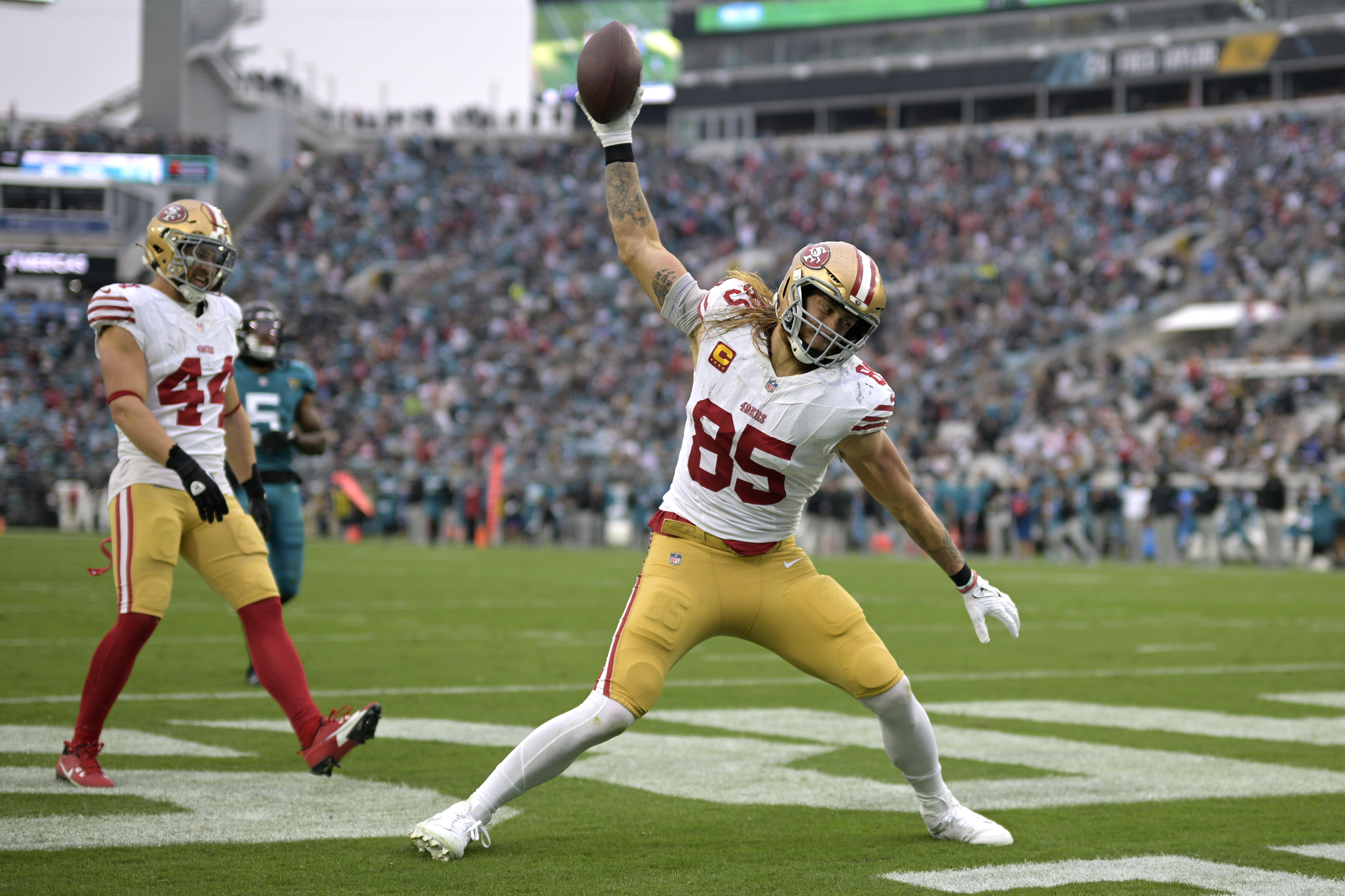 San Francisco 49ers tight end George Kittle (85) celebrates after scoring a touchdown during the second half of an NFL football game against the Jacksonville Jaguars, Sunday, Nov. 12, 2023, in Jacksonville, Fla.