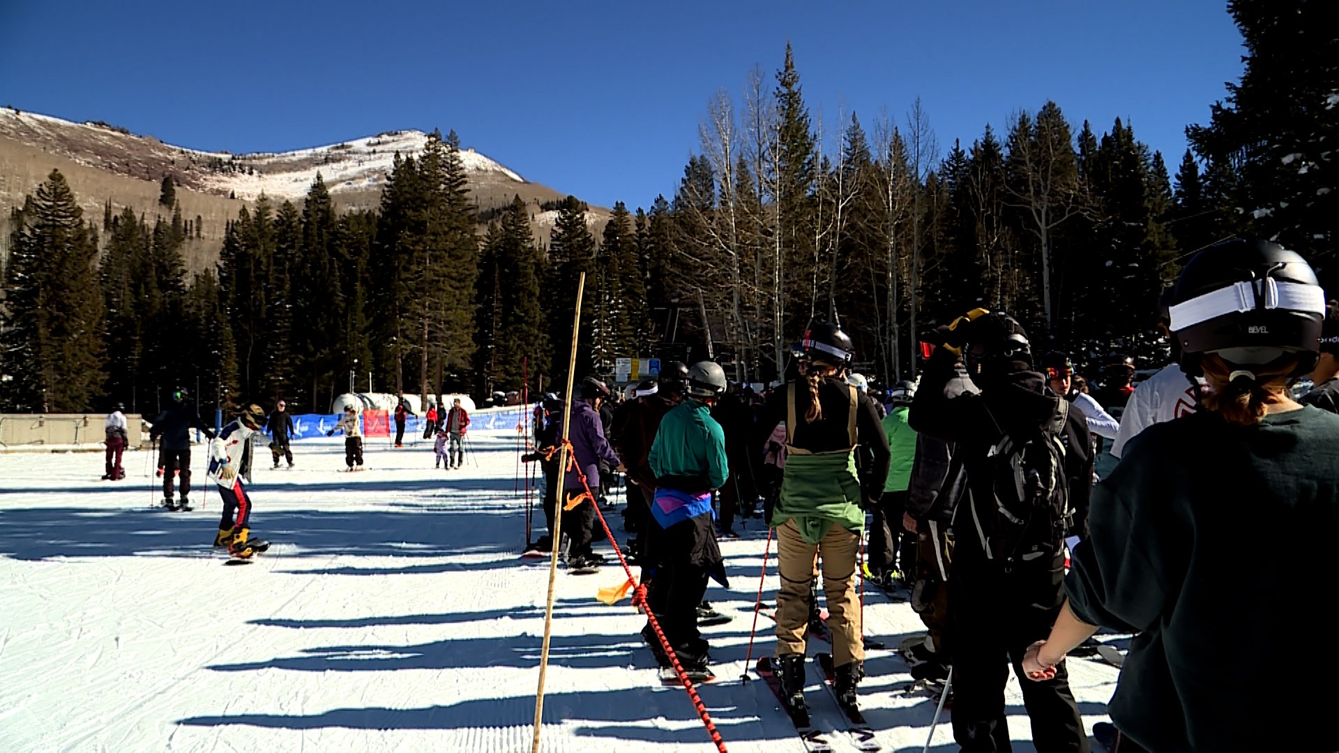 Hundreds of skiers and snowboarders alike waited in line, hopping on the ski lift one by one Sunday at Solitude Mountain Resort in Big Cottonwood Canyon.