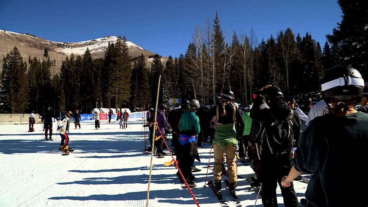 Hundreds of skiers and snowboarders alike waited in line, hopping on the ski lift one by one Sunday at Solitude Mountain Resort in Big Cottonwood Canyon.