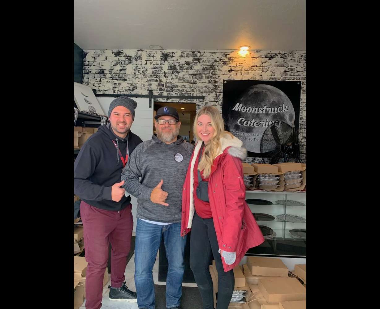 Ian Pizarro with his wife, Brittany Pizarro, and the owner at Moonstruck Catering. Ian Pizarro survived an aortic dissection in November 2014. As a way to show gratitude, he provides Thanksgiving meals for families in need.