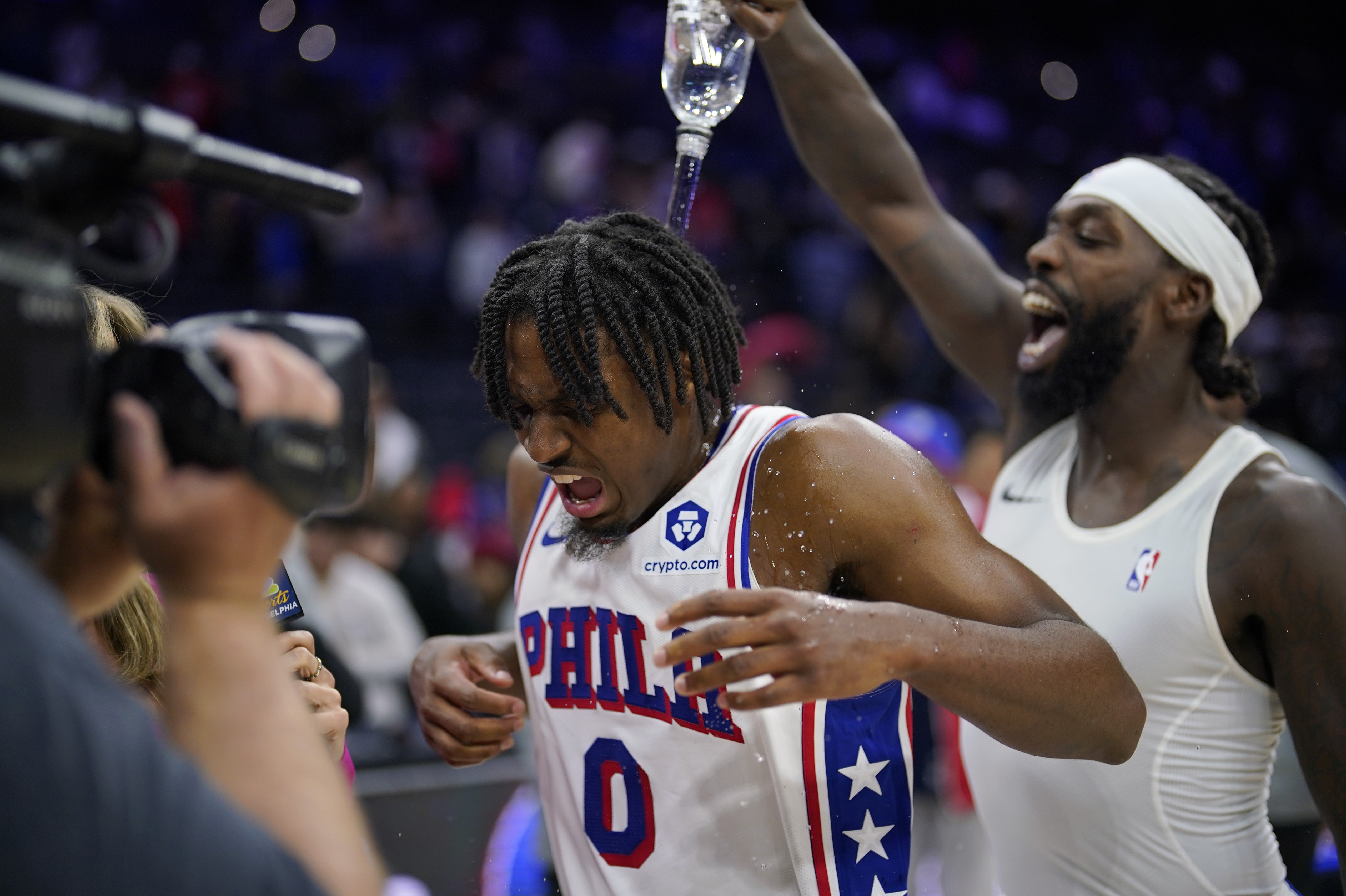 Philadelphia 76ers' Tyrese Maxey, center, is doused by Patrick Beverley after an NBA basketball game against the Indiana Pacers, Sunday, Nov. 12, 2023, in Philadelphia. 