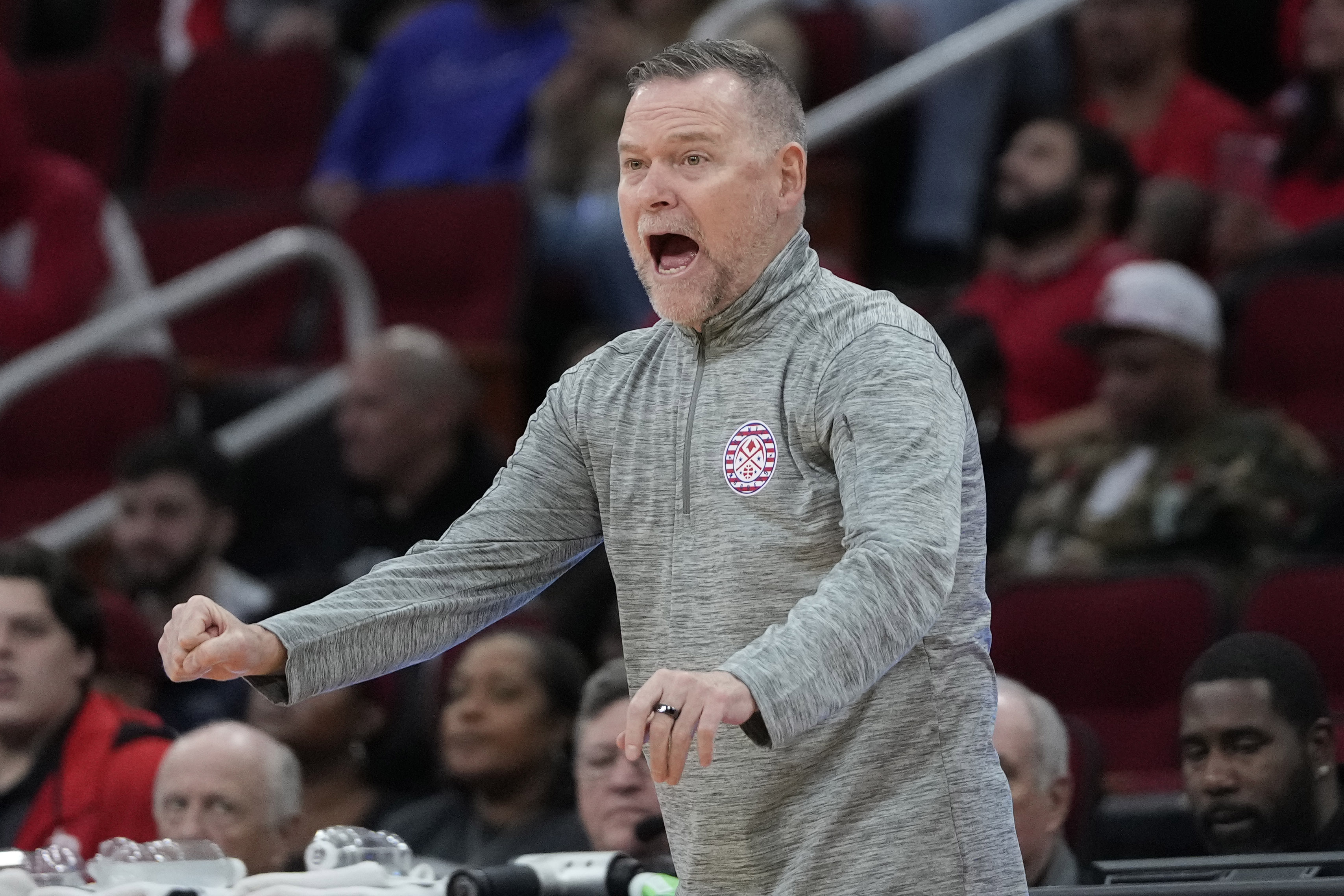 Denver Nuggets coach Michael Malone calls a play during the first half of an NBA basketball game against the Houston Rockets Sunday, Nov. 12, 2023, in Houston. 