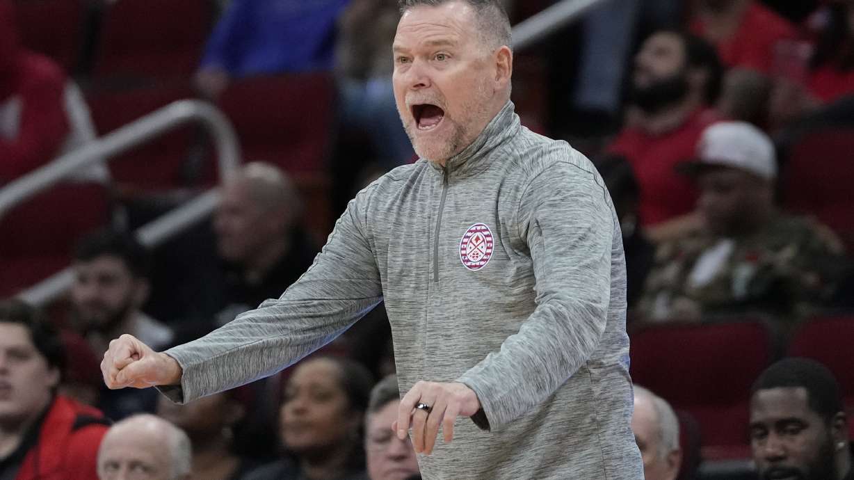 Denver Nuggets coach Michael Malone calls a play during the first half of an NBA basketball game against the Houston Rockets Sunday, Nov. 12, 2023, in Houston.