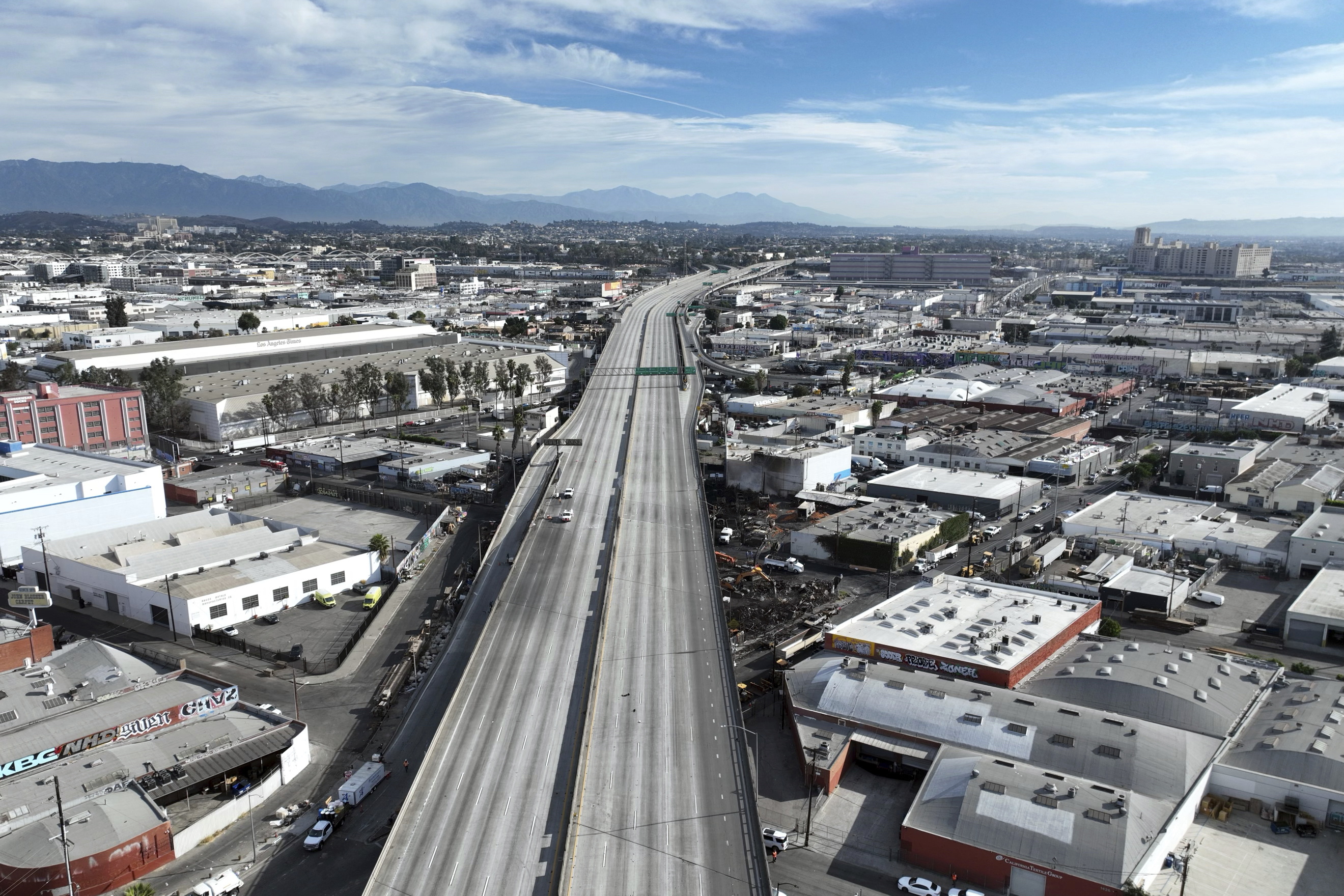 Interstate 10 is empty due to a closure in the aftermath of a fire, Monday in Los Angeles.
