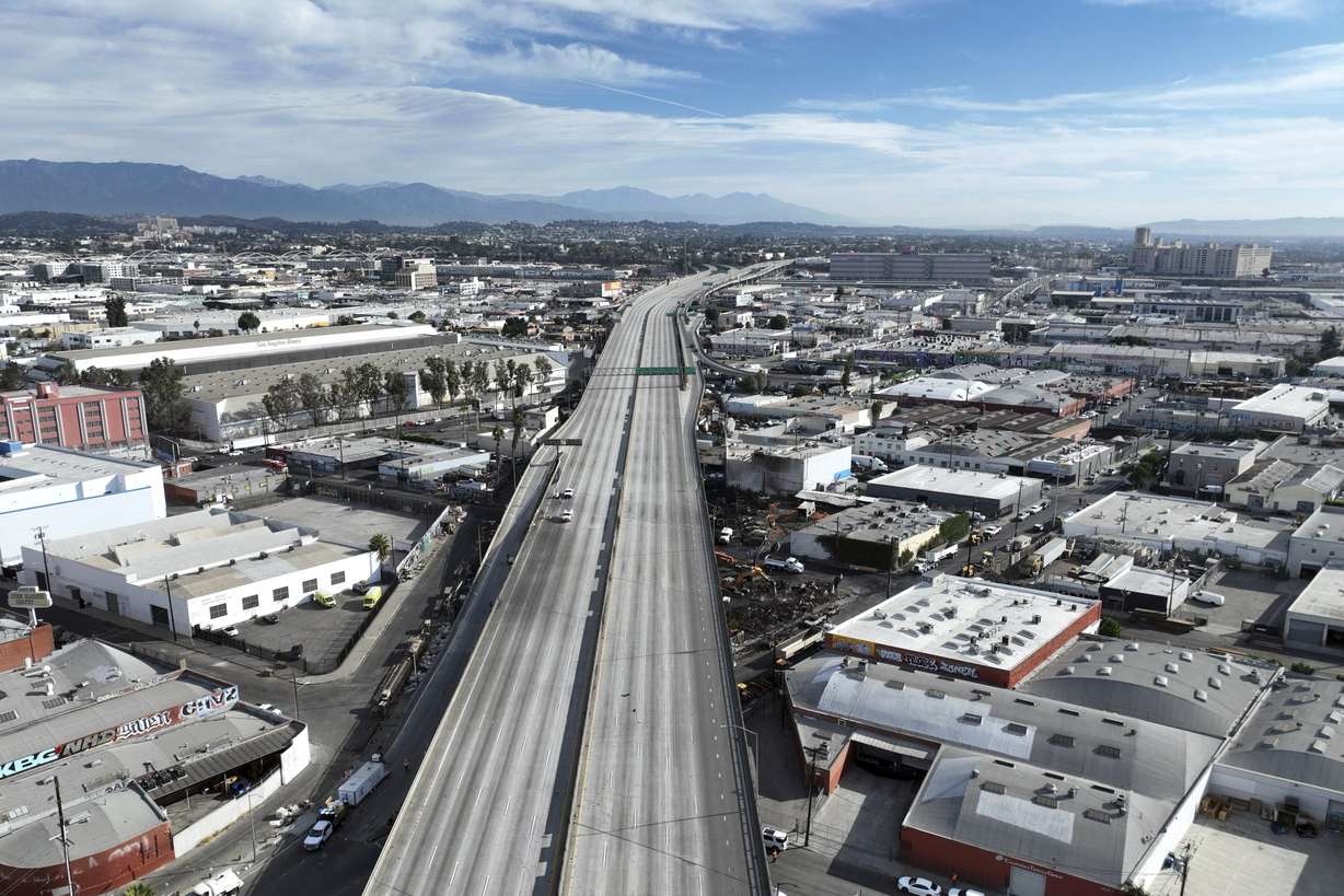 Interstate 10 is empty due to a closure in the aftermath of a fire, Monday in Los Angeles.