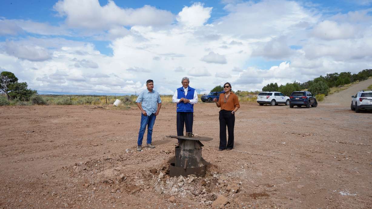 From left, Navajo Nation hydrologist Ryan Barton, Utah State University mentor Clayton Long and project manager Corey Higdon observe a new well installed by the city of Blanding in this undated photo.