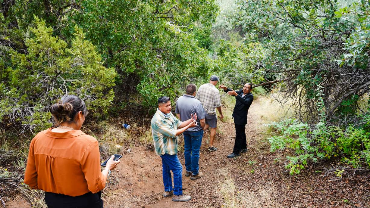 Westwater community President Thomas Chee takes project managers to artesian well, an archeological site he hopes to protect in this undated photo.