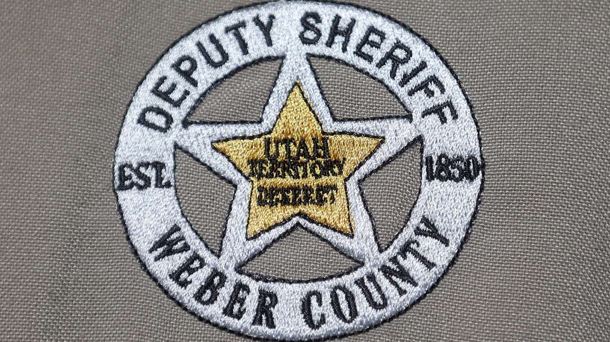 A woman was in serious condition after sheriff's officials say she was stabbed by her husband Monday evening in Weber County.