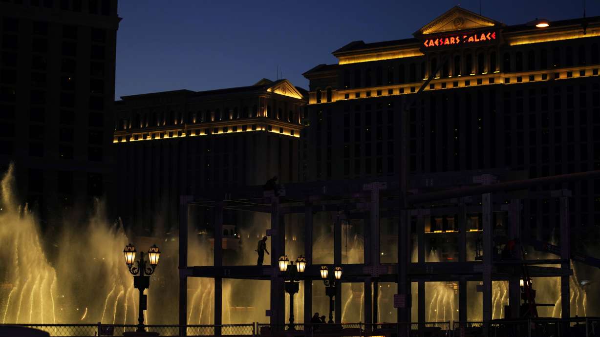 Construction workers build a grandstand in front of the fountains at Bellagio hotel-casino along the Las Vegas Strip ahead of the Las Vegas Formula One Grand Prix auto race Tuesday, Sept. 19, 2023, in Las Vegas.