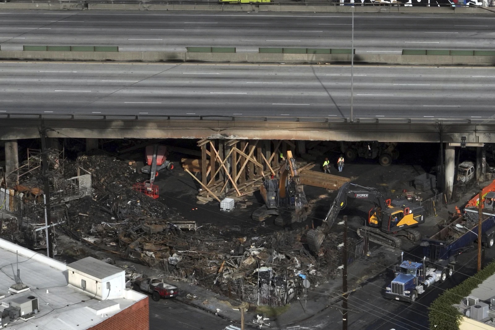 The site of a fire is shown under Interstate 10, in an aerial view, Monday in Los Angeles.