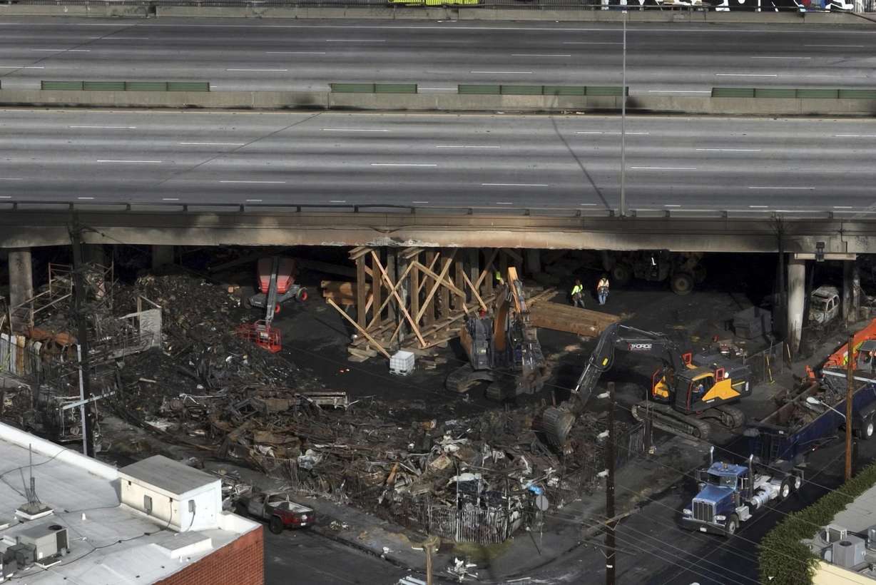 The site of a fire is shown under Interstate 10, in an aerial view, Monday in Los Angeles.