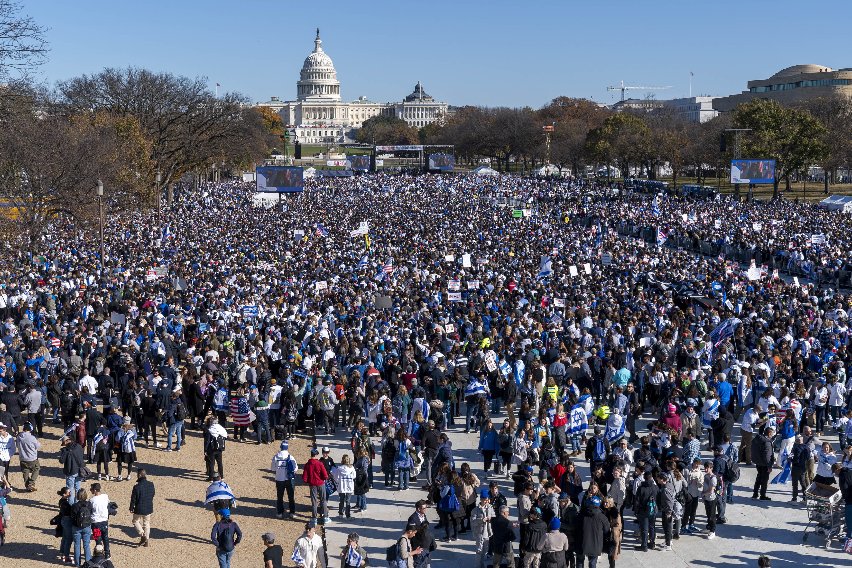 People attend the March for Israel rally Tuesday on the National Mall in Washington. Supporters of Israel have rallied by the tens of thousands on Washington's National Mall, voicing solidarity in the fight against Hamas and crying "never again."
