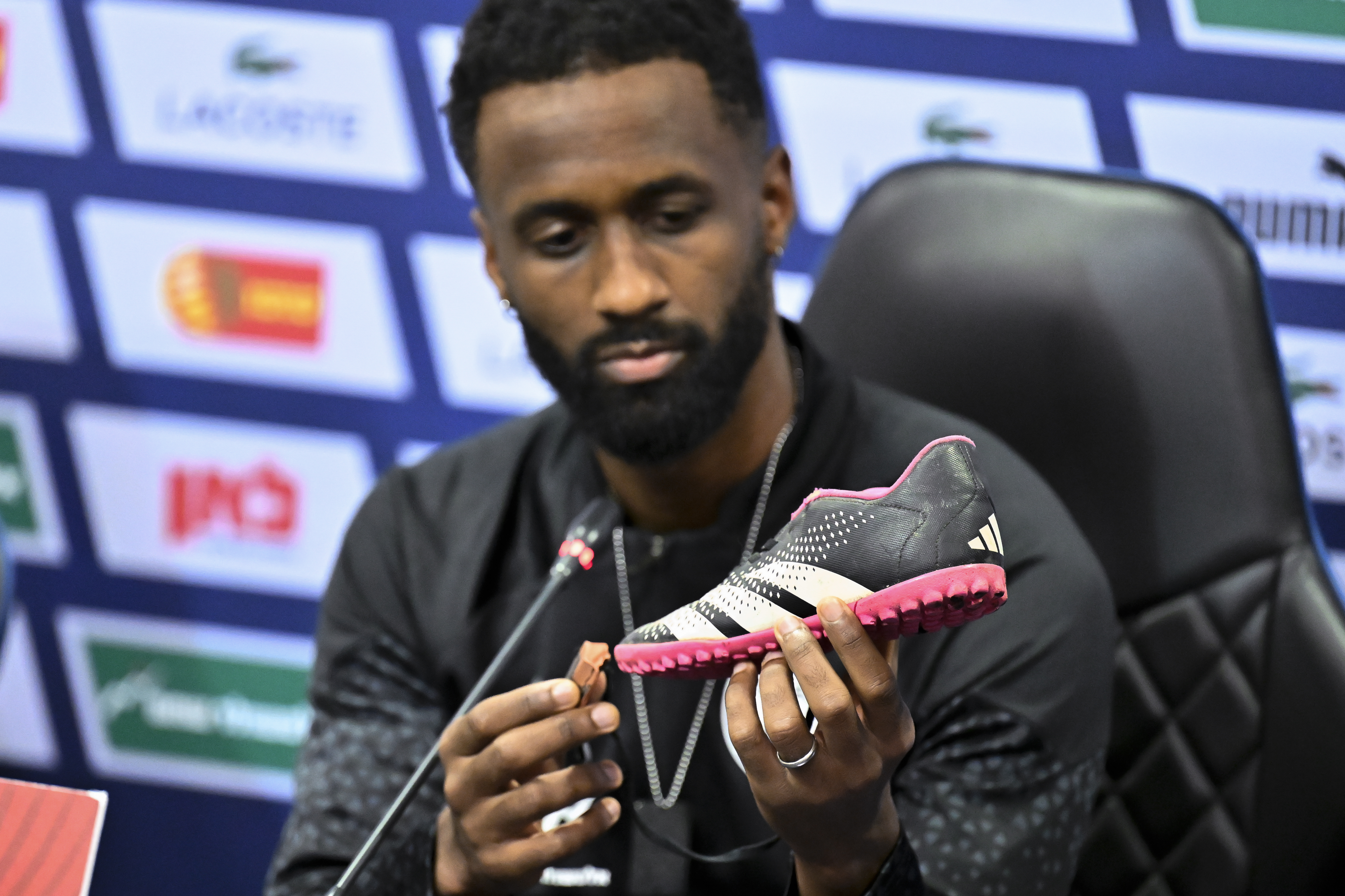 Israel team captain Eli Dasa shows a shoe of a kidnapped Israeli boy during a press conference, before a training session for the Euro 2024 group I qualifying soccer match between Israel and Switzerland at the Pancho Arena in Felcsút, Hungary, Tuesday, Nov. 14, 2023. The captain of Israel's soccer team on Tuesday displayed the shoe of a young boy that he said was kidnapped by Hamas militants during their deadly Oct. 7 raid, an act of solidarity with those Israelis still being held captive in the Gaza Strip ahead of the team's Wednesday game in Hungary.