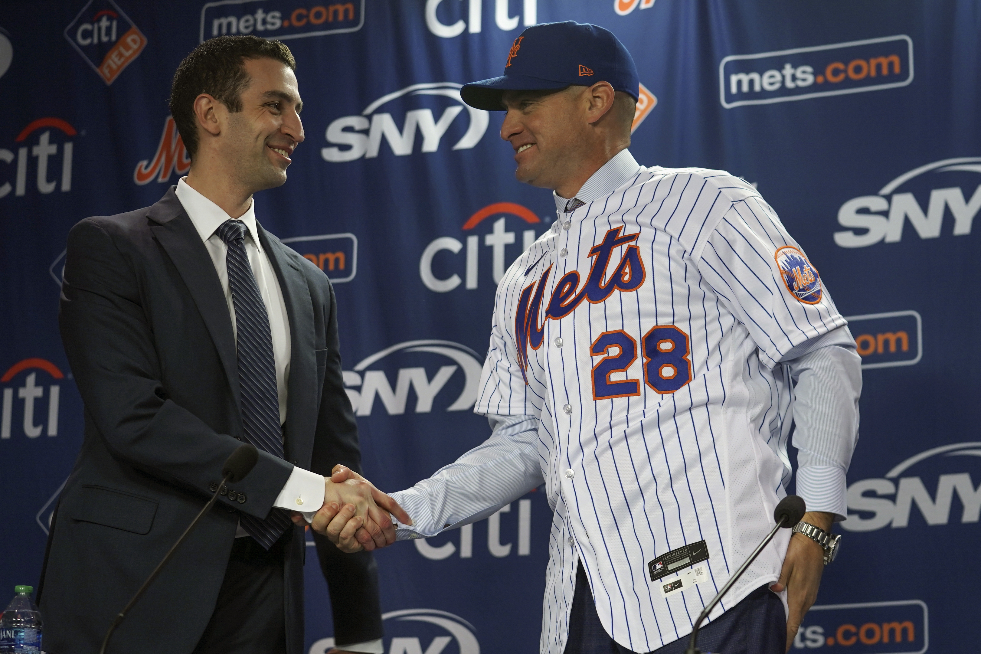 New York Mets president of baseball operations David Stearns, left, introduce new Mets manager, Carlos Mendoza, Tuesday, Nov. 14, 2023, at Citifield in New York.