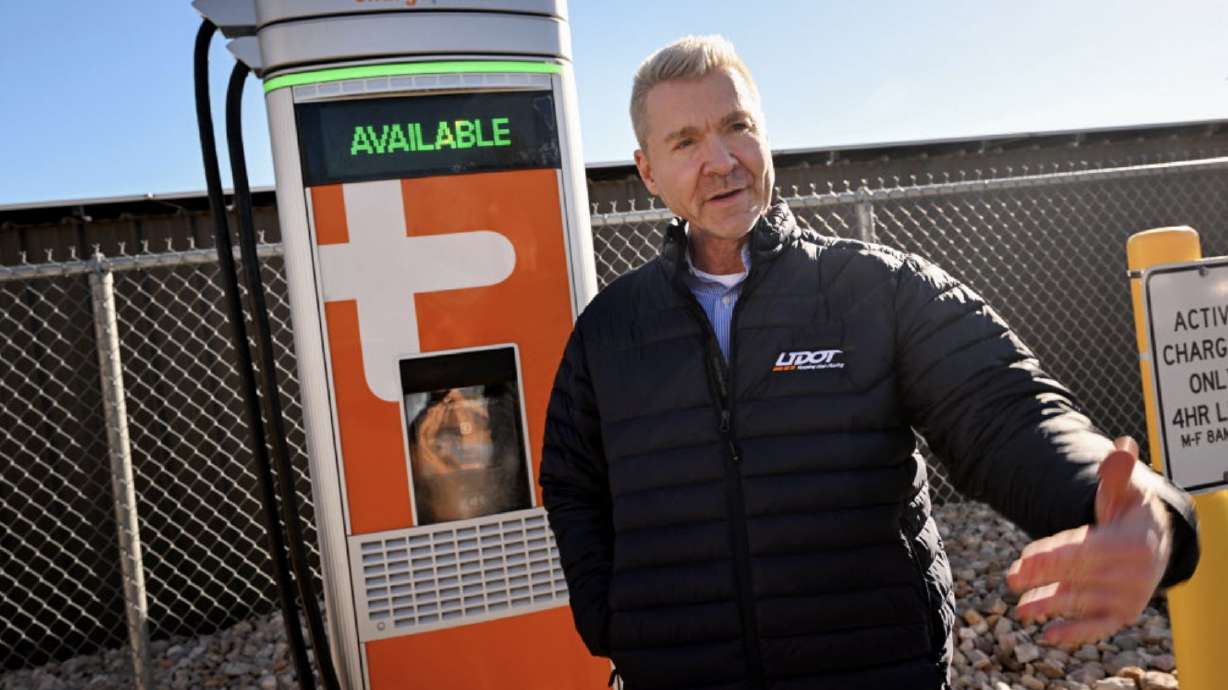 UDOT strategic investments director Lyle McMillan talks about an upcoming project to increase the number of EV charging stations in the state in Taylorsville on Tuesday. UDOT says it's helping facilitate 15 new fast-charging sites.