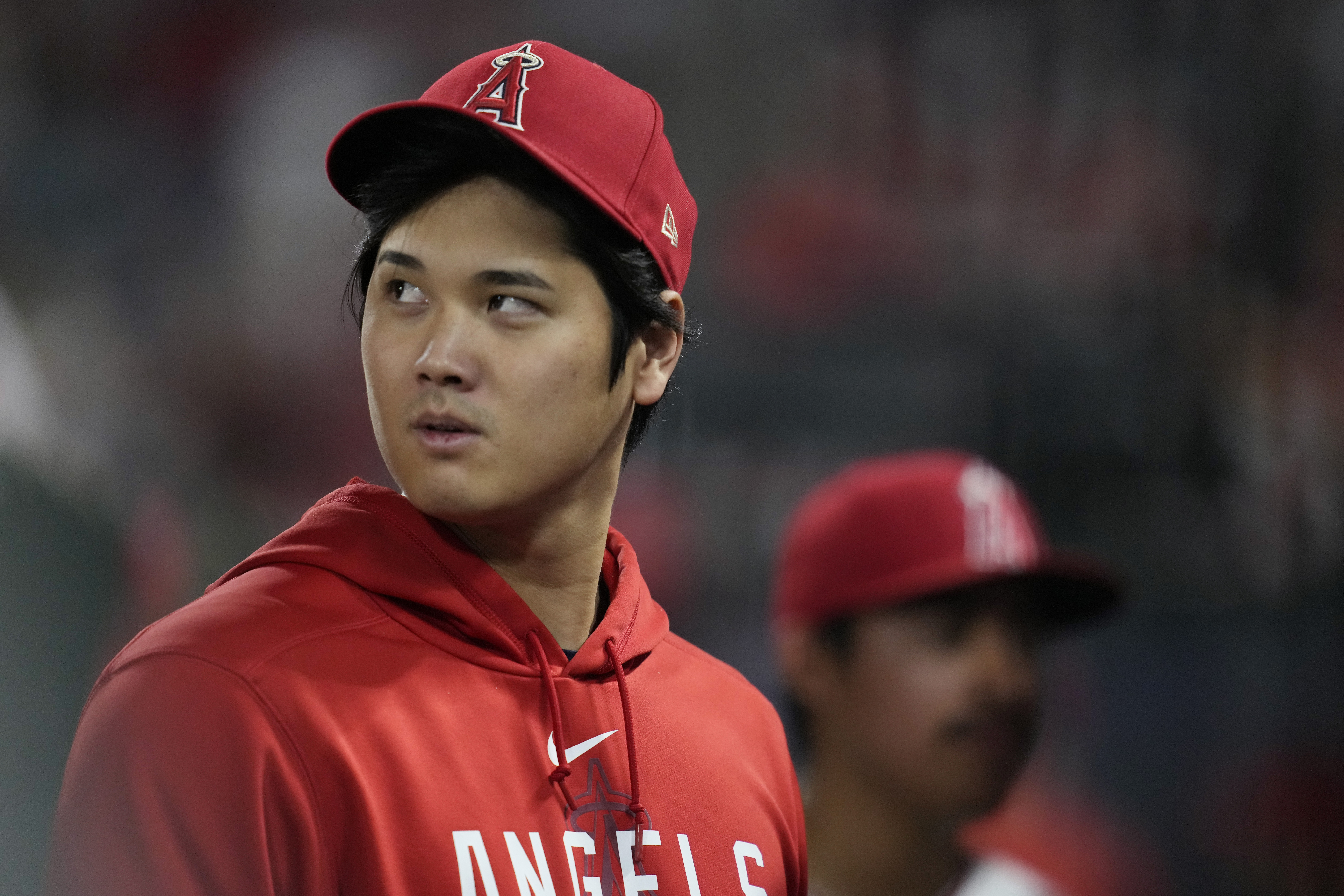 FILE - Los Angeles Angels' Shohei Ohtani walks in the dugout during the ninth inning of the team's baseball game against the Detroit Tigers in Anaheim, Calif., Sept. 16, 2023. Ohtani, Cody Bellinger, Jordan Montgomery, Blake Snell and Aaron Nola were among the 130 players who became free agents Thursday, Nov. 2, as baseball's business season began the day following the Texas Rangers' first World Series title. Max Muncy, Joe Jiménez and Colin Rea gave up a chance to go free and agreed to new contracts with their teams. 