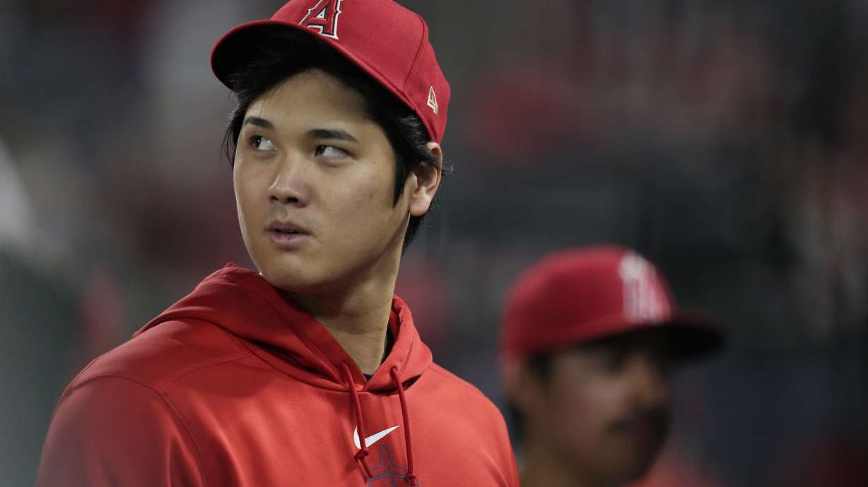 FILE - Los Angeles Angels' Shohei Ohtani walks in the dugout during the ninth inning of the team's baseball game against the Detroit Tigers in Anaheim, Calif., Sept. 16, 2023. Ohtani, Cody Bellinger, Jordan Montgomery, Blake Snell and Aaron Nola were among the 130 players who became free agents Thursday, Nov. 2, as baseball's business season began the day following the Texas Rangers' first World Series title. Max Muncy, Joe Jiménez and Colin Rea gave up a chance to go free and agreed to new contracts with their teams.