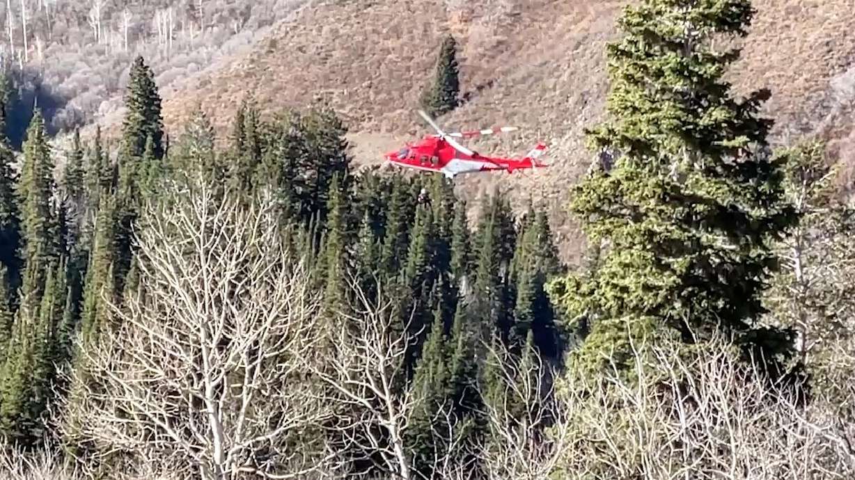 A Life Flight helicopter is used to rescue the lone survivor of an airplane crash near Kyhv Peak in Utah County on Tuesday. Two others died in the crash, according to the Utah County Sheriff's Office.