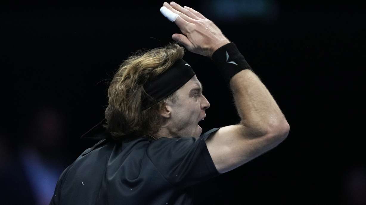Russia's Andrej Rublev reacts during the singles tennis match against Spain's Carlos Alcaraz, of the ATP World Tour Finals at the Pala Alpitour, in Turin, Italy, Wednesday, Nov. 15, 2023.