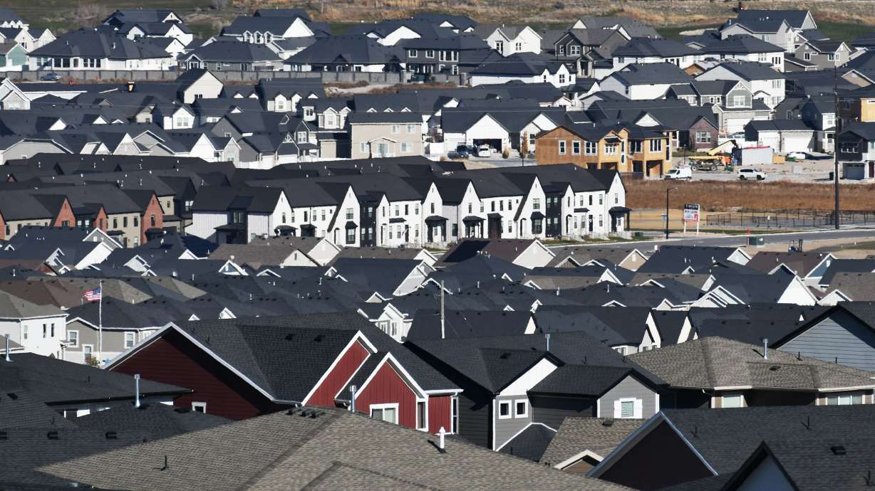 Single-family homes and town houses are seen in the Lehi area on Tuesday. Older Americans — those typically on the tail end of the baby boom — are the ones buying and selling all the houses in the hot U.S. housing market.