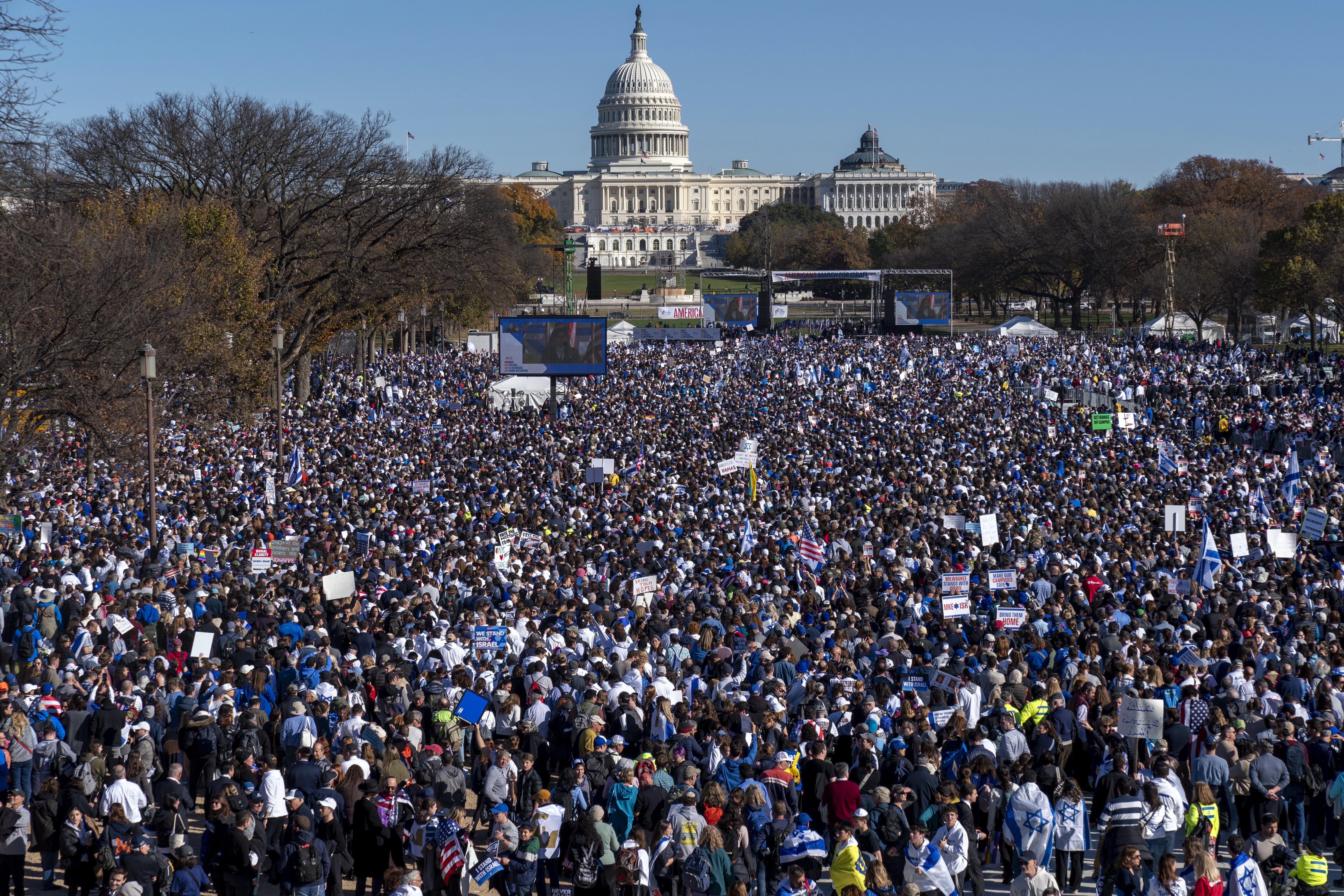 People attend the March for Israel rally on Tuesday on the National Mall in Washington. Sen. Romney and Rep. John Curtis described meeting the parent of a hostage in a post on social media.