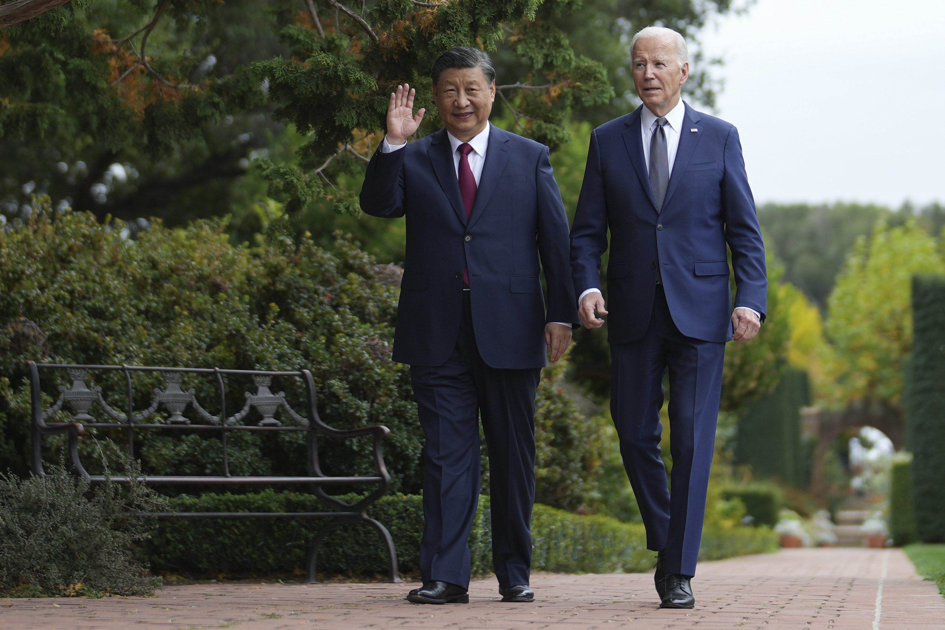 President Joe Biden and China's President President Xi Jinping walk in the gardens at the Filoli Estate in Woodside, Calif., Wednesday, on the sidelines of the Asia-Pacific Economic Cooperative conference.