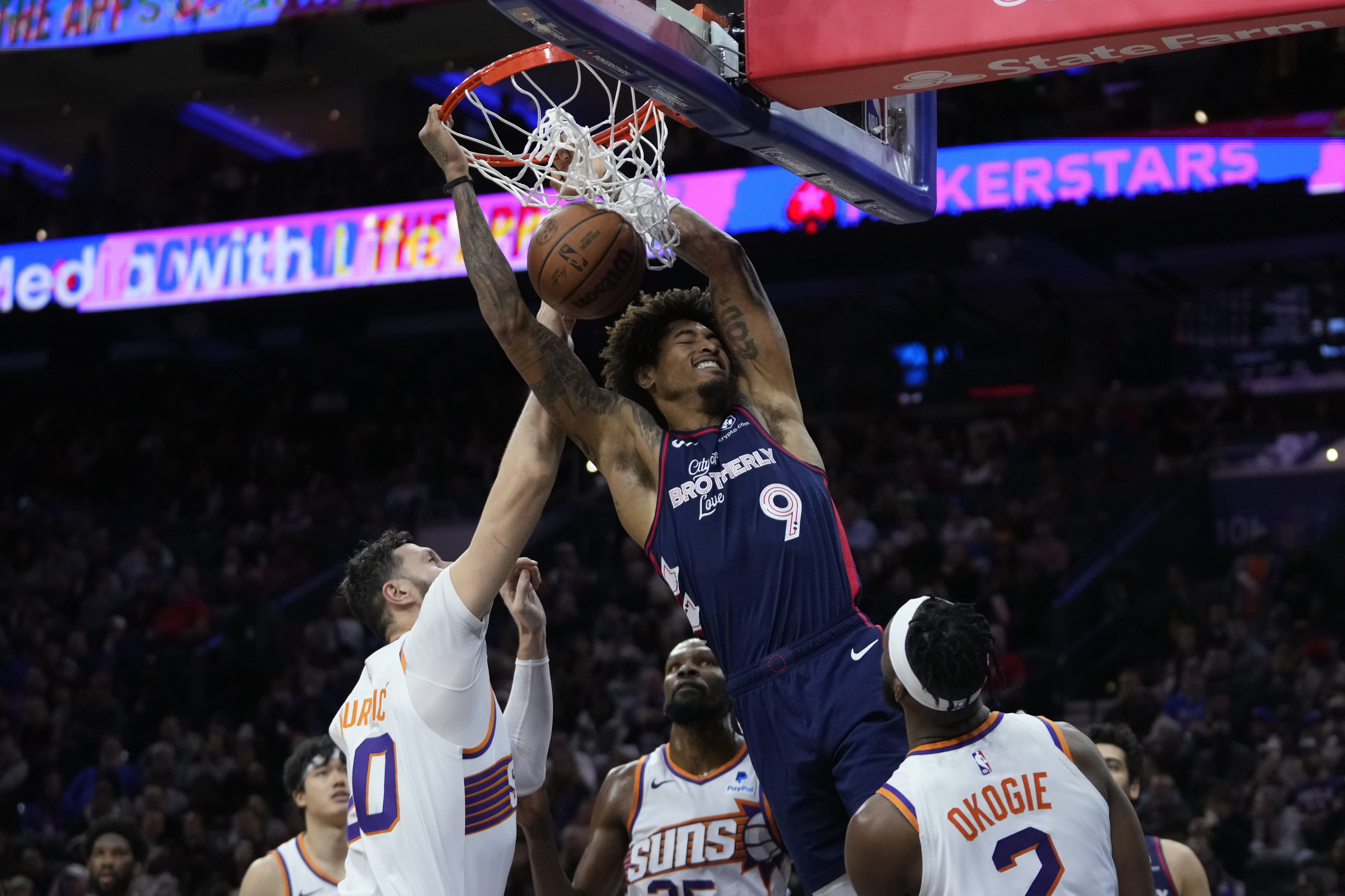 Philadelphia 76ers' Kelly Oubre Jr., center, dunks past Phoenix Suns' Jusuf Nurkic, from left, Kevin Durant and Josh Okogie during the second half of an NBA basketball game, Saturday, Nov. 4, 2023, in Philadelphia.
