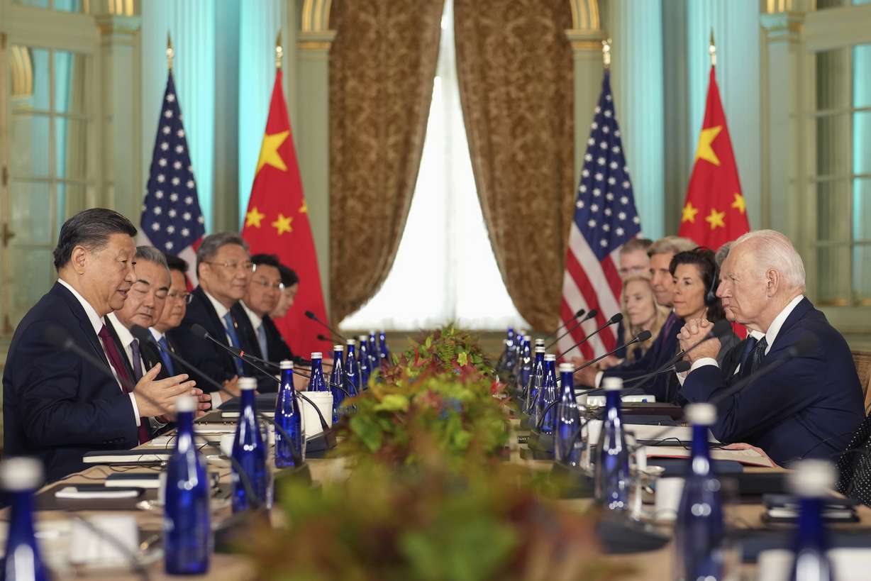 President Joe Biden listens as China's President President Xi Jinping speaks during their meeting at the Filoli Estate in Woodside, Calif., Wednesday, on the sidelines of the Asia-Pacific Economic Cooperative conference.