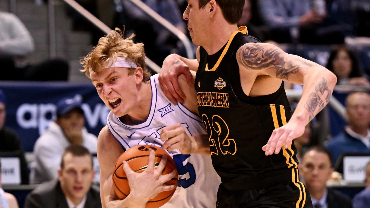 Brigham Young guard Richie Saunders (15) works to get to the basket with Southeastern Louisiana guard Nick Caldwell (22) defending as BYU and SE Louisiana play at the Marriott Center in Provo on Wednesday, Nov. 15, 2023. BYU won 105-48.