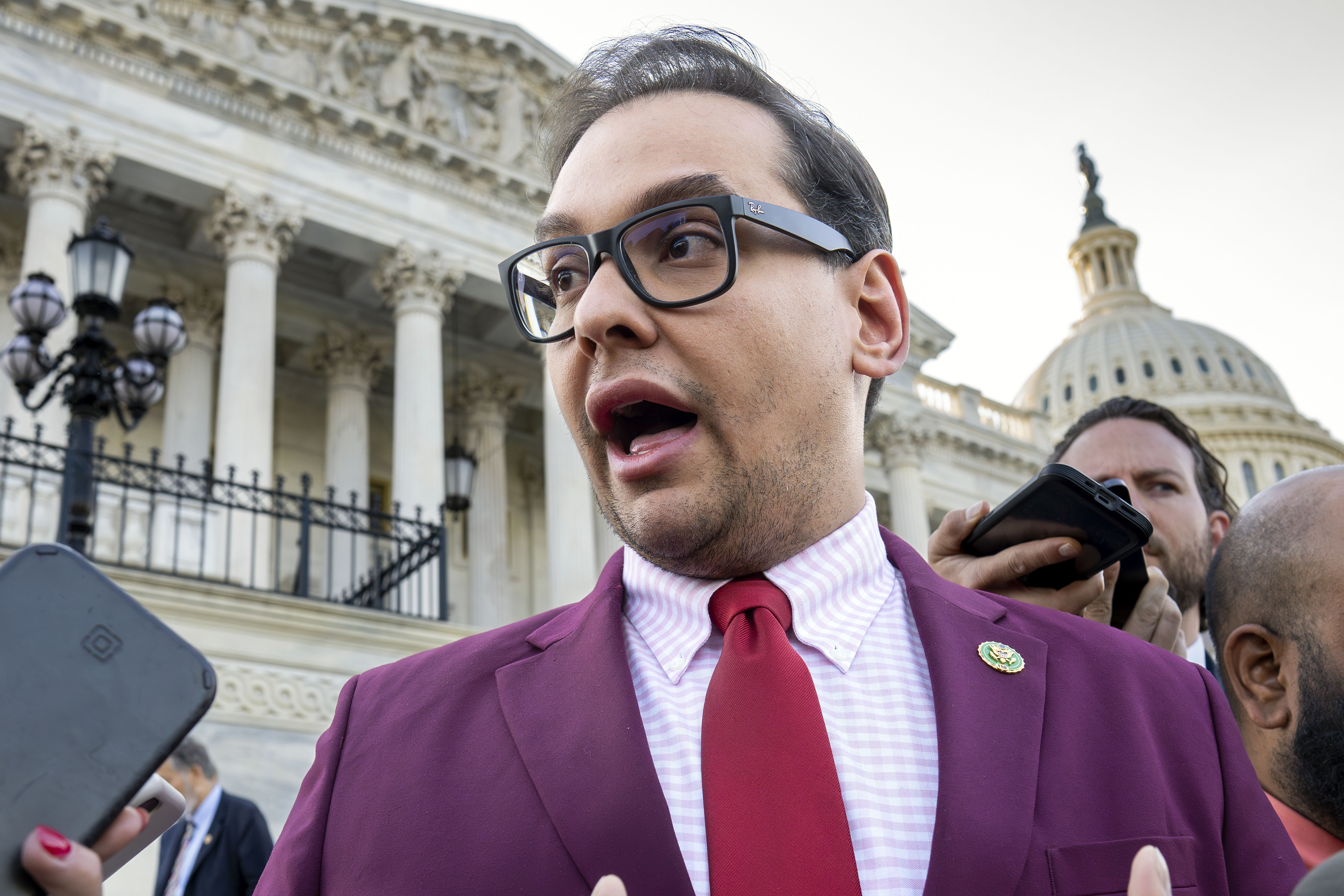 Rep. George Santos, R-N.Y., speaks to reporters outside the Capitol, in Washington, May 17. House Ethics Chairman Michael Guest introduced a resolution Friday to expel Santos from Congress.