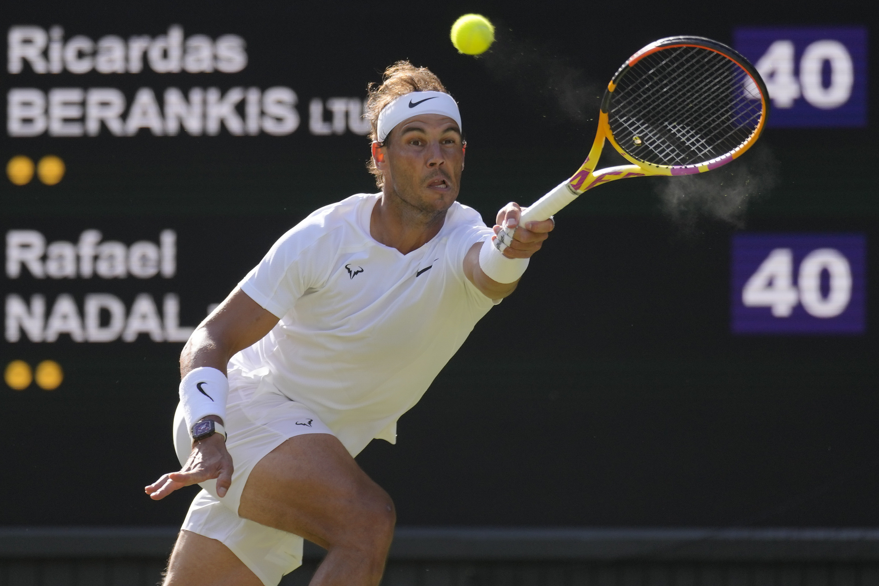 FILE - Spain's Rafael Nadal returns to Lithuania's Ricardas Berankis in a second round men's singles match for the Wimbledon tennis championships in London, June 30, 2022. Nadal is sure he'll be returning to competition after missing nearly all of 2023 with a hip injury that required surgery. And now he says he'll be revealing his comeback plans soon. Nadal wrote Thursday, Nov. 16, 2023 on social media: “I confirmed yesterday I'll be back” and punctuated that message with a smiling emoji.