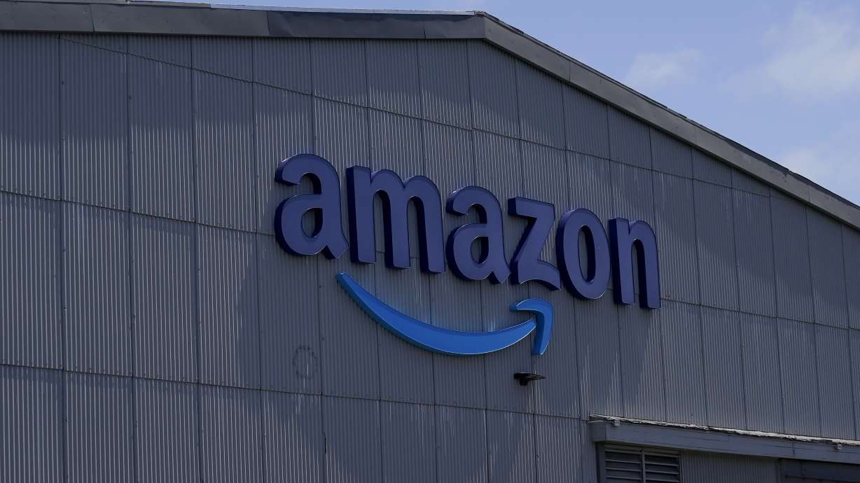 An Amazon sign in San Francisco, May 25. Amazon will launch vehicle sales in the U.S. next year and allow local car dealers to sell directly to customers on its site.