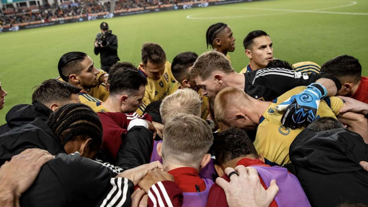 Real Salt Lake players huddle after the team's final game against Houston.