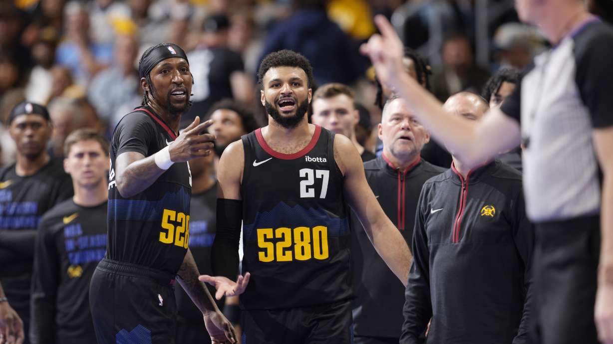 referee Ed Malloy, right, issues a technical foul on Denver Nuggets guard Jamal Murray (27), as guard Kentavious Caldwell-Pope gestures during the second half of the team's NBA basketball in-season tournament game against the Dallas Mavericks on Friday, Nov. 3, 2023, in Denver.