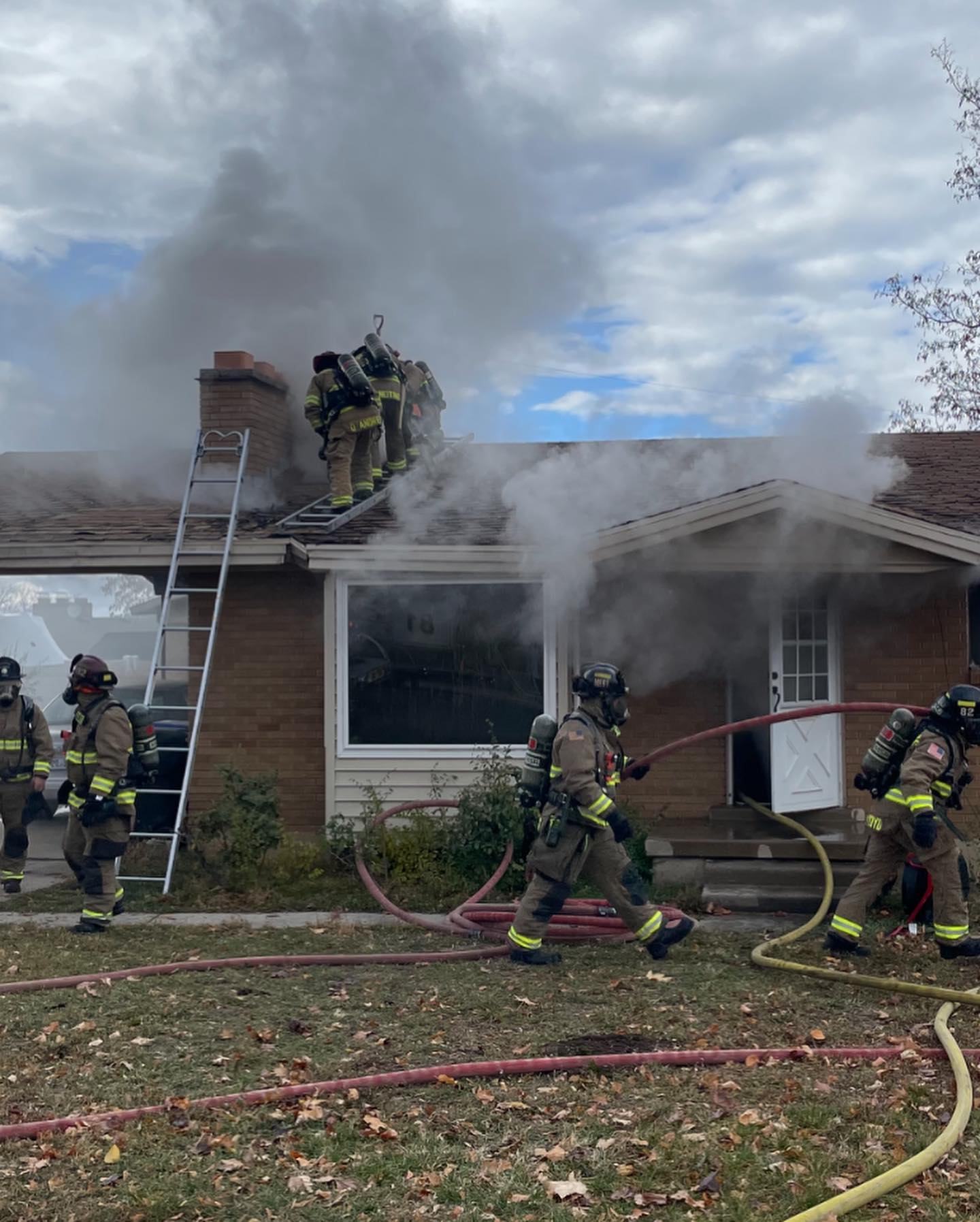 Firefighters work to extinguish a house fire that killed one person in Bountiful Thursday.