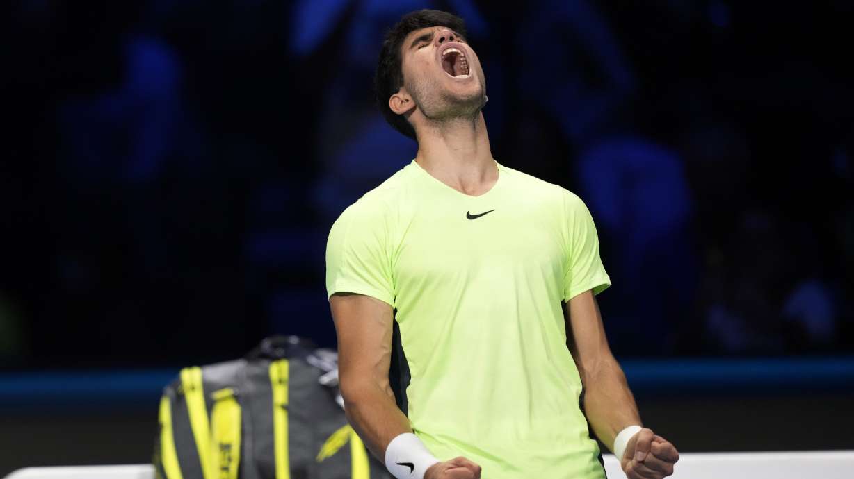 Spain's Carlos Alcaraz celebrates after winning the singles tennis match against Russia's Daniil Medvedev, of the ATP World Tour Finals at the Pala Alpitour, in Turin, Italy, Friday, Nov. 17, 2023.