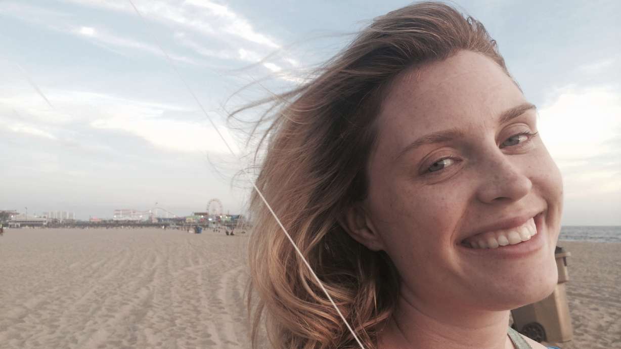 This family photo shows Casey McIntyre. Less than a week after her death from cancer on Nov. 12, the New York woman has raised enough money to erase more than $13 million in medical debt for others with a posthumous plea for help.